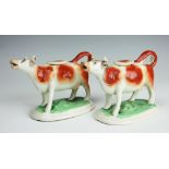 A pair of 19th century Staffordshire pearl ware cow creamers, circa 1870, each 11.