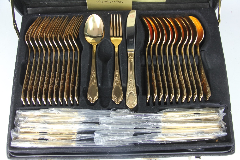 A Bestecke Solingen gold plated canteen; comprising twelve dinner forks, twelve dinner knives, - Image 3 of 3