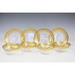 A set of four French St Louis Cristal gilt decorated glass bowls and saucers,