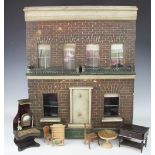 A late 19th century dolls house and furniture,