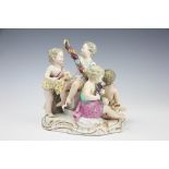 A Meissen allegorical group, modelled as four cherubs with baskets of flowering garlands,