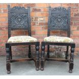 A set of six Victorian carved and stained oak dining chairs, with lion mask backs and drop in seats,