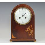 An Edwardian mahogany and inlaid mantle clock,