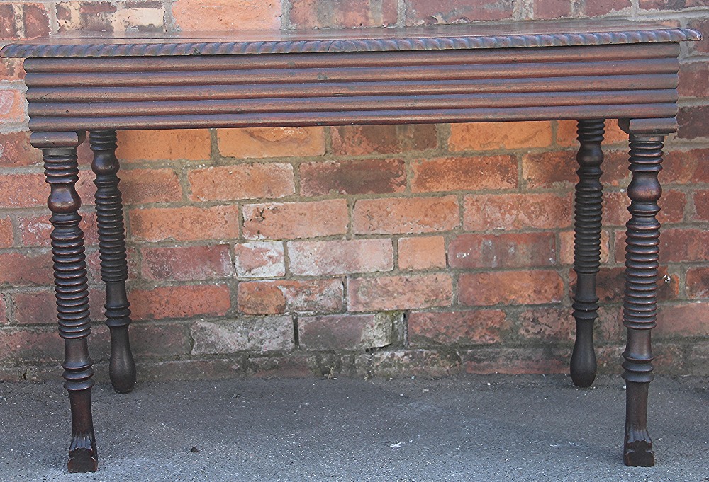 A William IV mahogany serving table, possibly Irish, the two piece top with a gadrooned edge,