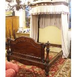 A Victorian and later mahogany half tester bed, with serpentine canopy and upholstered head board,