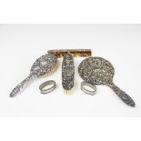 A German '800' standard silver four piece dressing table set, mirror, comb and two brushes,