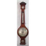 A Negretti & Zambra mahogany wheel barometer, with silvered dial, thermometer and spirit level,