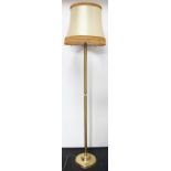 A brass standard lamp, on circular base, 135cm. Lighting lots are sold as decorative items only.