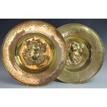 A pair of Dutch embossed and engraved brass chargers / alms dishes, early 20th century,