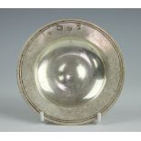 A silver circular dish, Lowe & Sons, Chester 1962, of plain design with displayed hallmarks,