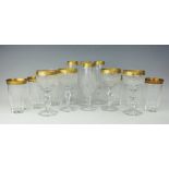 A part suite of gilt decorated and cut glass glasses, comprising; four wine glasses, 18.