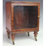 A 19th century low display / bijouterie cabinet, with glazed door, on turned feet,