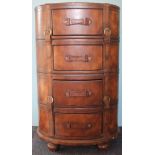 A vintage style tan leather oval chest of four short drawers, on bun feet,