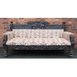 A large and impressive Victorian carved oak hall settee,