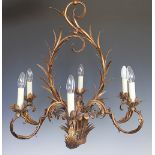 A modern Louis XV style gilt metal six branch chandelier decorated throughout with scrolling