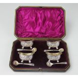 A Victorian cased set of four silver plated salts and spoons, James Dixon & Sons,