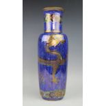 A Wedgwood dragon lustre vase, decorated with one dragon and clouds against a blue ground,