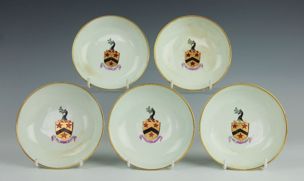 Five Lowestoft armorial porcelain saucers, circa 1790,