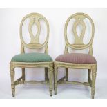 A set of six 18th century style painted wood dining chairs, with oval back and upholstered seats,