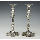 A pair of silver candlesticks, London 1965, of 18th century design, with detachable nozzles,