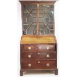 A George III oak bureau bookcase,