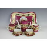 A Czechoslovakian porcelain cabaret set comprising; a coffee pot and cover, 15cm high,