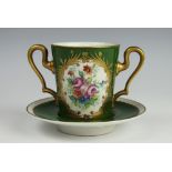 A French Limoges porcelain chocolate cup and saucer,
