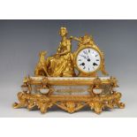 A French Louis XVI style gilt metal and alabaster mantle clock,