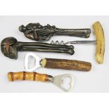 A selection of novelty nut crackers, to include; a skull example, a monkey example,