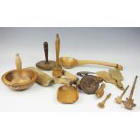 A collection of 19th century and later carved light wood kitchen utensils and accessories,