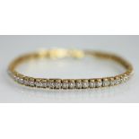 A diamond set tennis style bracelet,