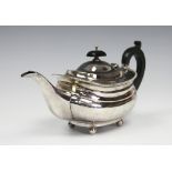 A silver teapot, Adie Brothers Ltd, Birmingham 1928, of low, rounded form,