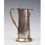 An Arts and Crafts silver pitcher, Henry Strafford, Sheffield 1902, in Archibald Knox style,