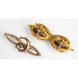 A garnet set brooch (converted from a pair of Victorian earrings, all set in yellow metal, unmarked,