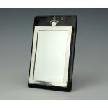 A George V rectangular silver photograph frame mounted on tortoiseshell and silver inlaid back,