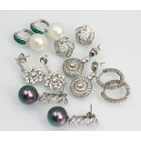 A collection of assorted earrings, to include; a pair of CZ and silver pearl effect drop earrings,