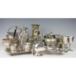 A selection of silver plated wares to include a heavily embossed pitcher,