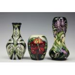 Three pieces of Moorcroft pottery, to include; a bluebell pattern gourd vase, circa 2003, 16cm high,