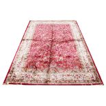 A Kashmir tree of life rug, worked against a red ground,