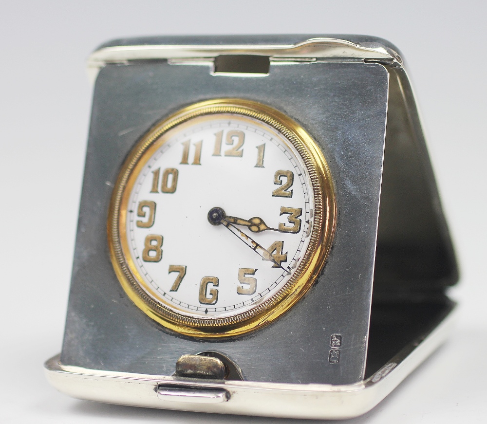 A George V silver travelling time piece, with Arabic dial and eight day movement, Chester 1922, 7.