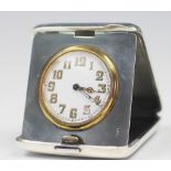 A George V silver travelling time piece, with Arabic dial and eight day movement, Chester 1922, 7.