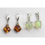 A pair of white gold set drop earrings, set with mixed cut citrine and diamond set drops,