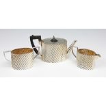 A Victorian silver three piece bachelors tea service, Hayes Brothers, Birmingham 1889,