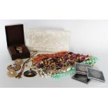 A selection of costume jewellery to include necklaces and brooches,
