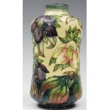 A Moorcroft Hellebore pattern vase, circa 1999, of cylindrical waisted form against a cream ground,