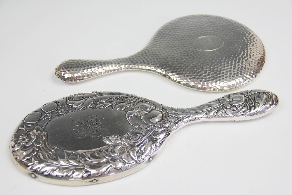 An Art Nouveau silver hand mirror, Birmingham 1901, decorated with poppies and initialled AMH, 31cm,