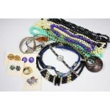 A collection of costume jewellery, to include; beads, necklaces, earrings, brooches,