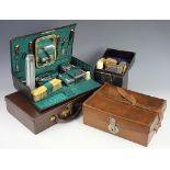 Gentlemans Interest: An Edwardian tan leather travelling case, with metal, wood and bone fittings,