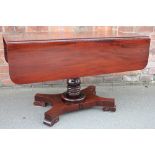 A 19th century mahogany Pembroke table, with drawer, on turned column and scroll legs,