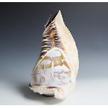 A cameo carved conch shell, carved centrally with a shipping port scene, light fitting to base,